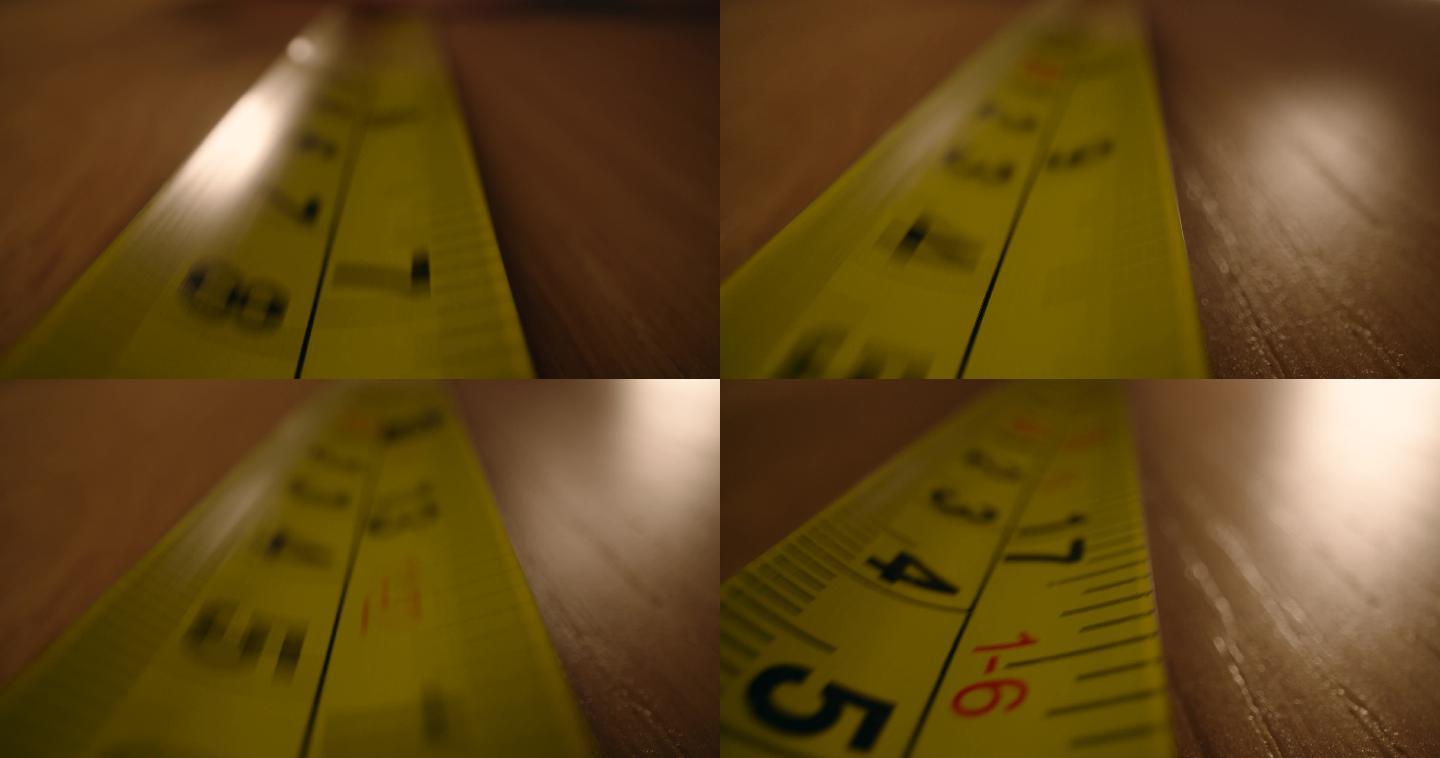 运动中的卷尺卷黄色尺子测量桌子长宽测量测