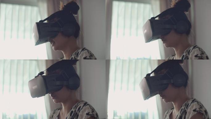 女孩戴上VR眼镜体验3D虚拟游戏