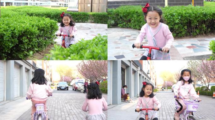 儿童骑平衡车女孩骑脚踏车玩耍