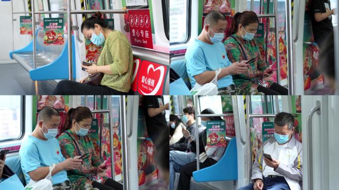 4K正版-公共交通上低头玩手机的中老年人