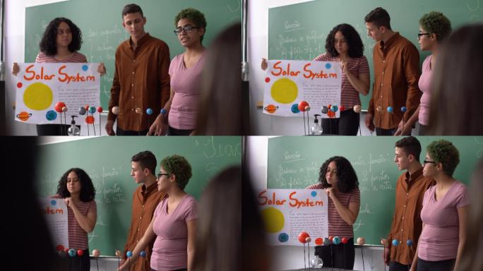 学生们在教室里做太阳系演示