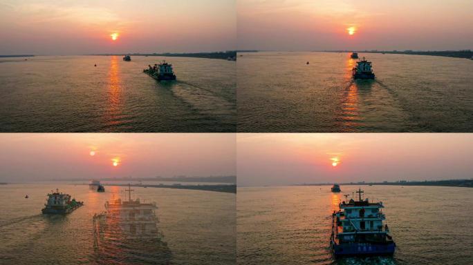 长江上夕阳下的轮船前进着航拍