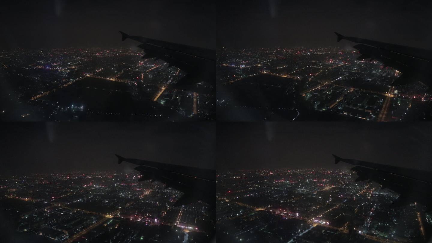 飞机深夜降落深圳宝安机场掠过万家灯火