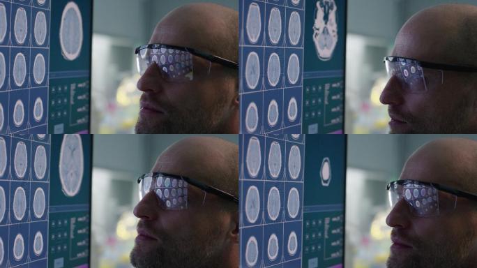 科学家在实验室检查大脑扫描。