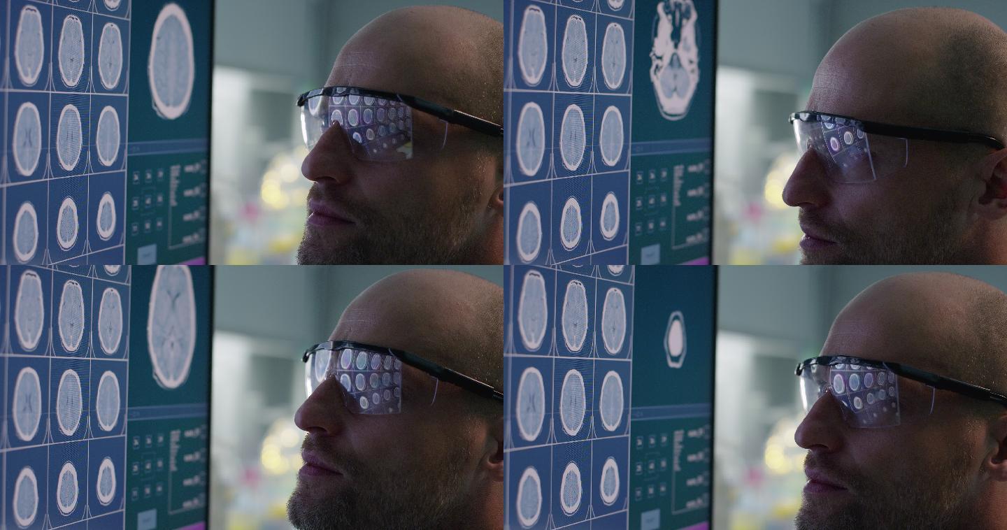 科学家在实验室检查大脑扫描。