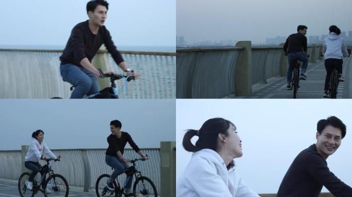 夫妻海边骑自行车情侣海边骑车