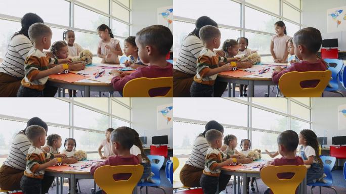 一位教师坐在日托中心的桌子旁教一群幼儿。