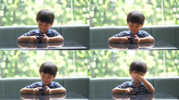 玩手机的小男孩小孩用眼过度保护视力公益广