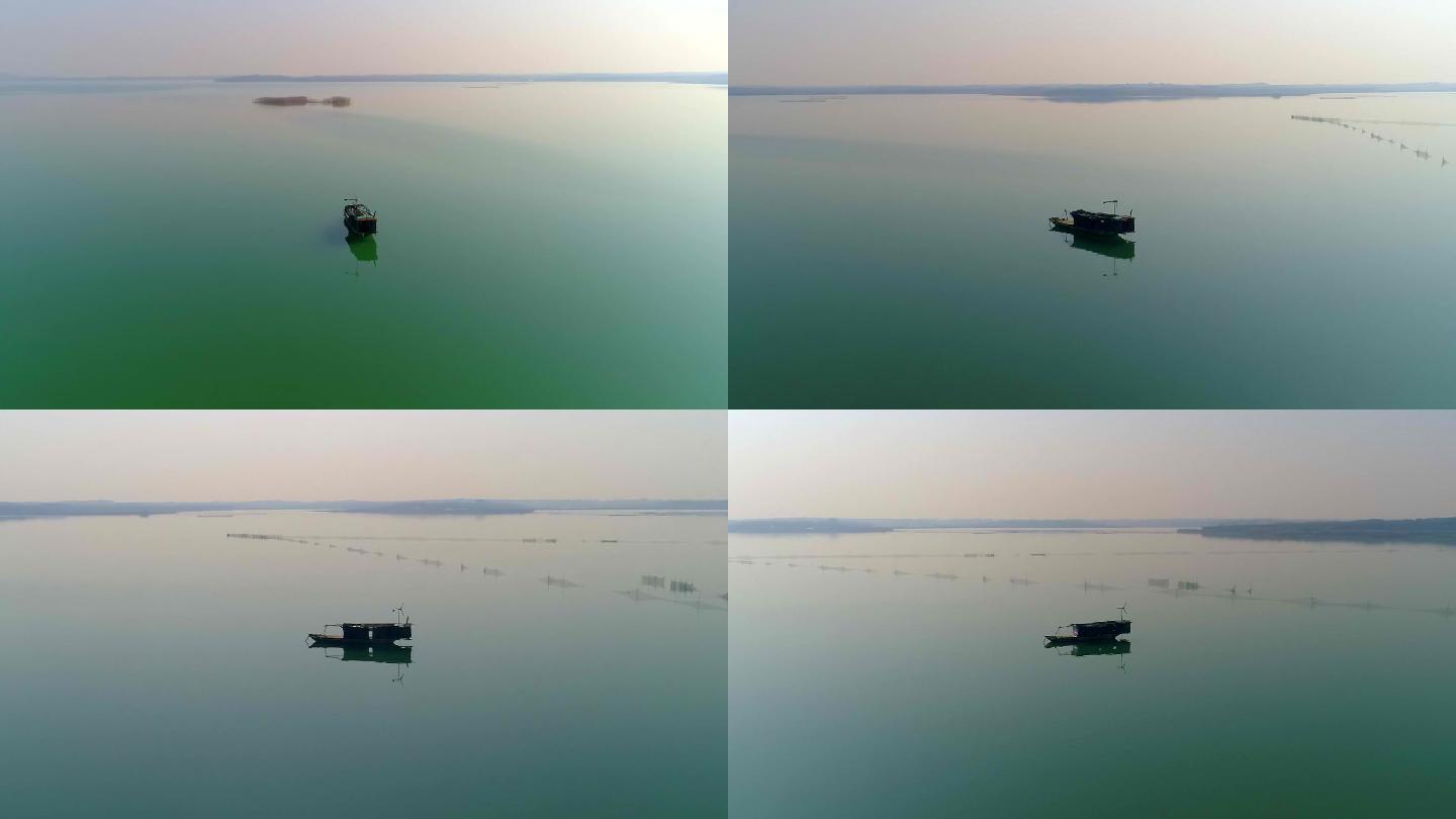 武汉梁子湖上一只小小渔船航拍环绕刷锅