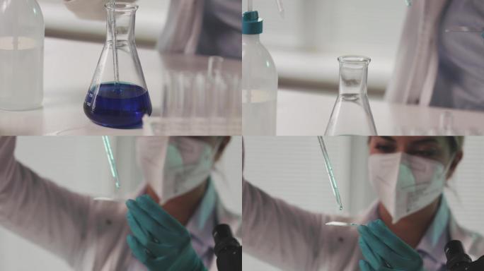 科学家用移液管在显微镜载玻片上滴下液体