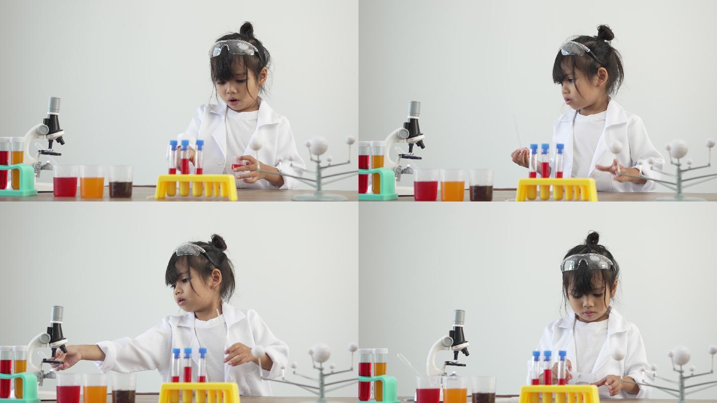 儿童在学校实验室使用显微镜进行科学实验