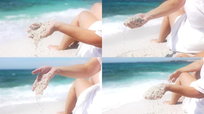 女子手玩沙子的慢镜头