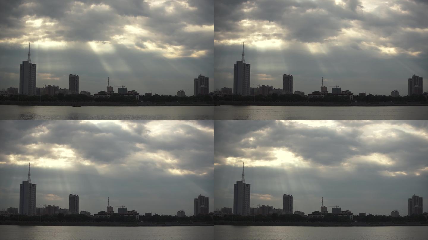 【延时摄影】河边城市阳光穿透云层