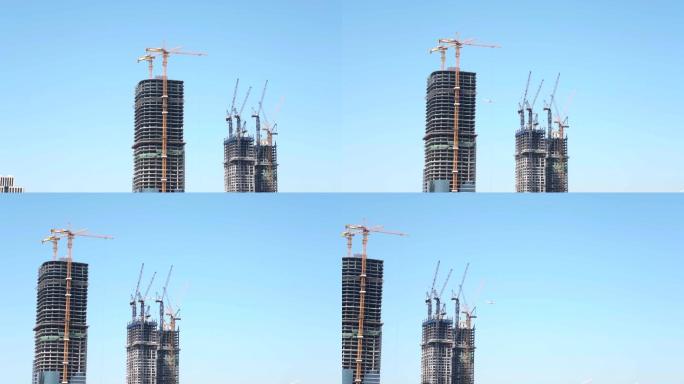 一架民航客机飞过正在建设的大厦