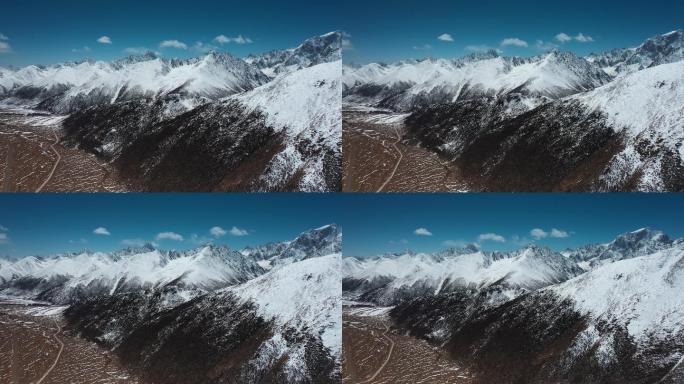 雪山峡谷视频青藏高原蓝天下延绵的雪山盆地