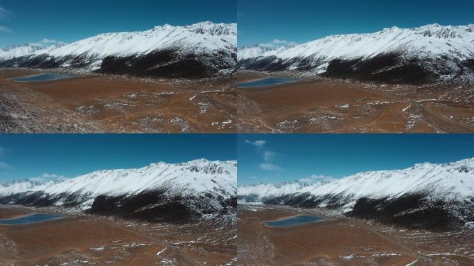 雪山盆地视频青藏高原延绵的雪山峡谷湖泊