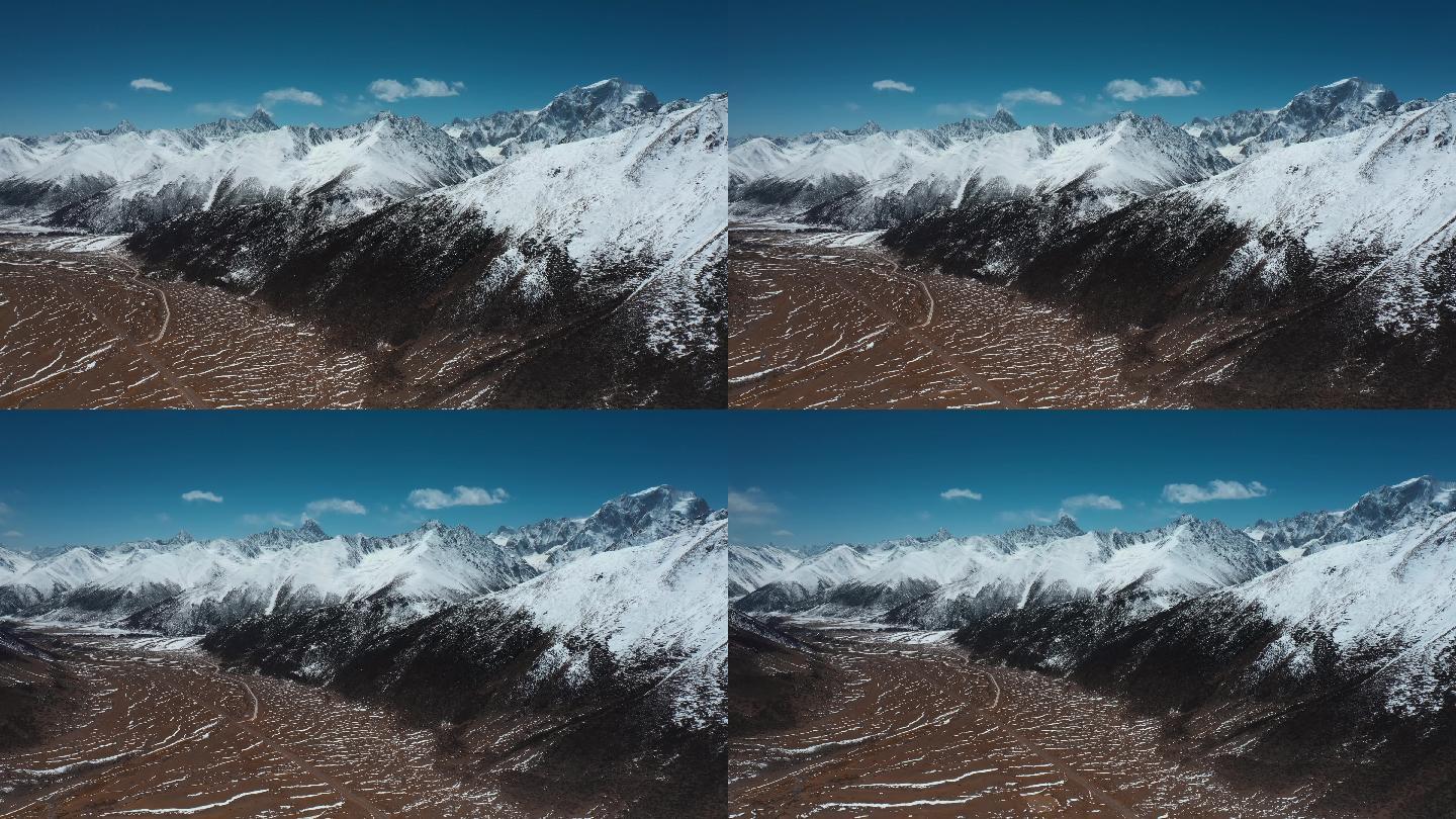 雪山峡谷视频青藏高原延绵的雪山盆地平原