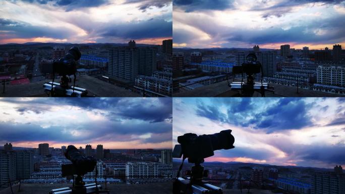 业余摄影爱好者楼顶拍摄日落