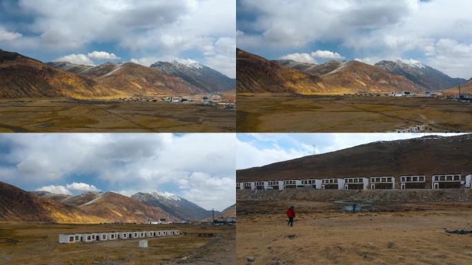 雪山牧场视频青藏高原冬季金色草地牧场村庄