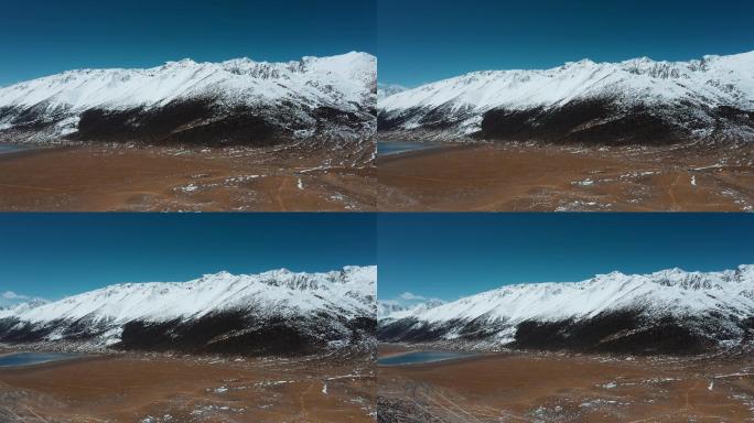 雪山平原视频青藏高原延绵的雪山峡谷湖泊