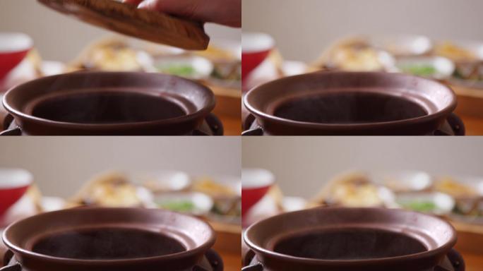 复古汤锅煲开盖热气实拍慢动作素材