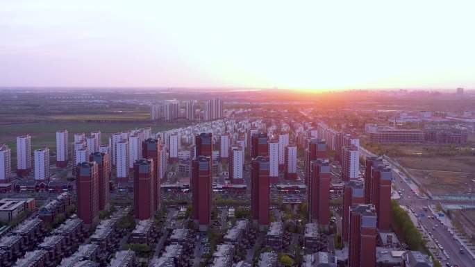 新农村建设航拍城市高楼夕阳绿地现代化