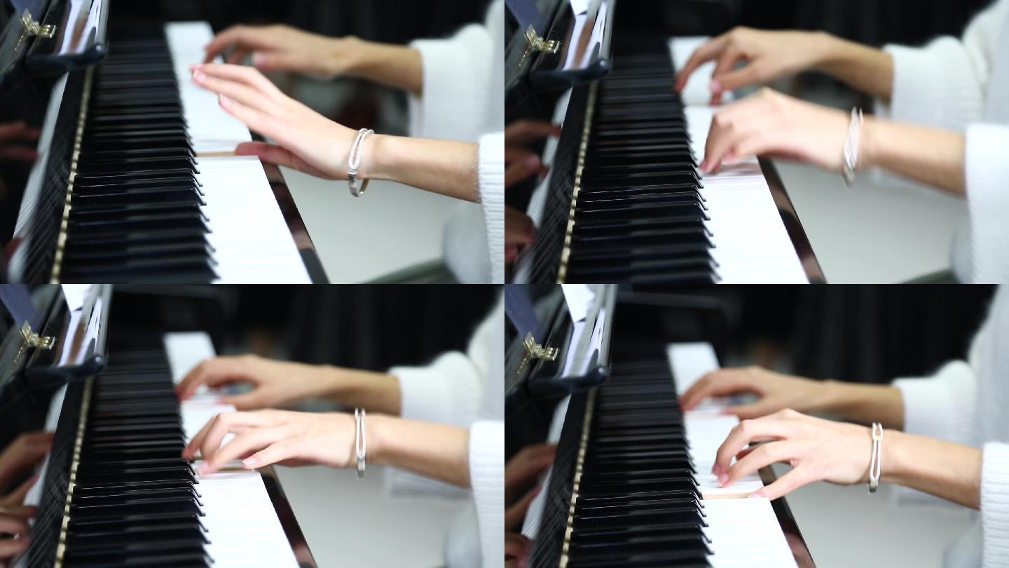 美女纤细的手指弹钢琴