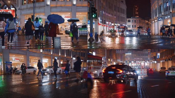 城市繁华街道雨天路口人群夜景