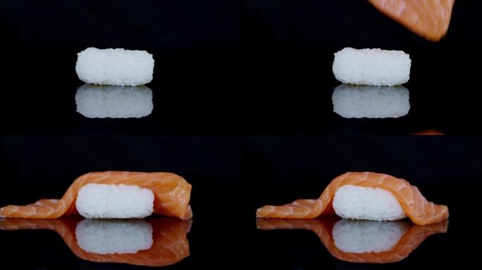 三文鱼片落下，制作三文鱼手握寿司