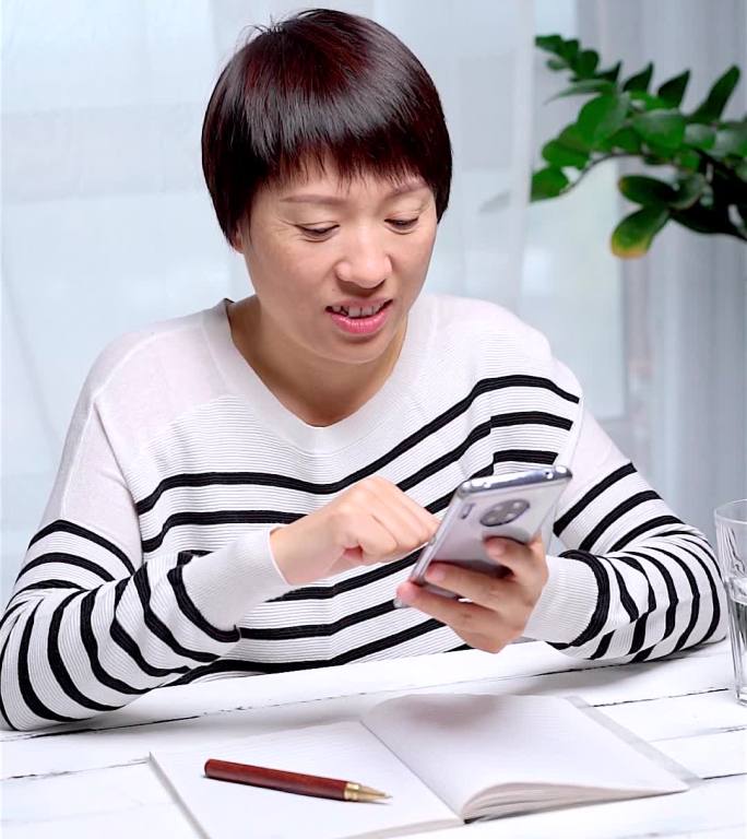 居家办公使用手机通讯的中国女性形象