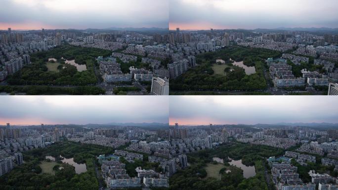 4K正版-航拍夕阳黄昏下公园与城市建筑群