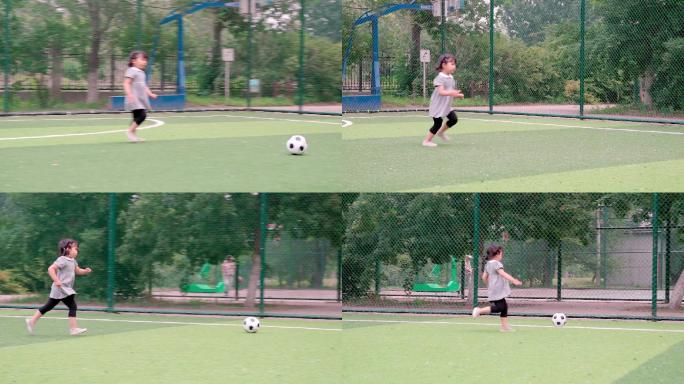 在足球场踢球的中国女童