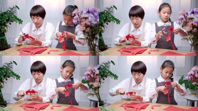 一起做手工剪纸的中国母女