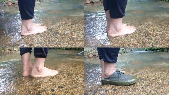 小溪石头光着脚丫洗脚穿鞋在鹅卵石上穿上鞋