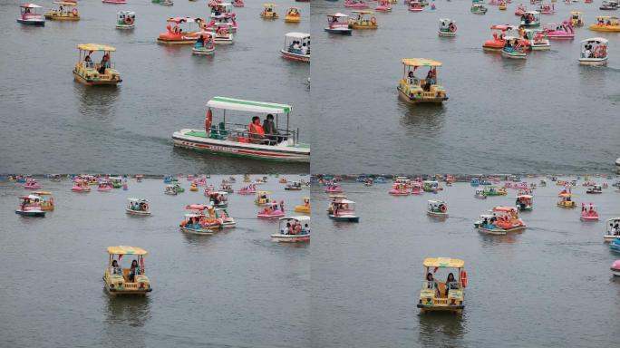 春天玉渊潭公园湖里游人划船游玩游船很多