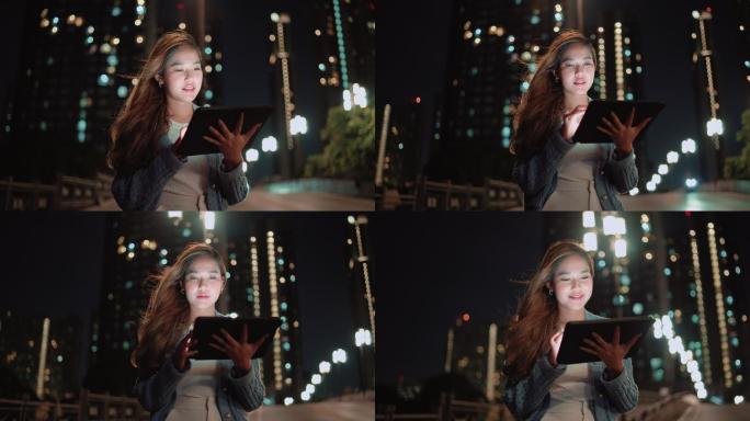 夜间使用数字平板电脑的女性