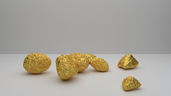 金色的石头从上面落在平坦的表面上。