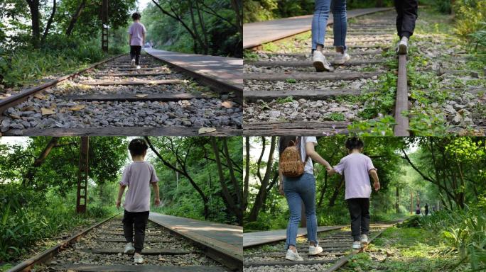 行走在火车道上的儿童