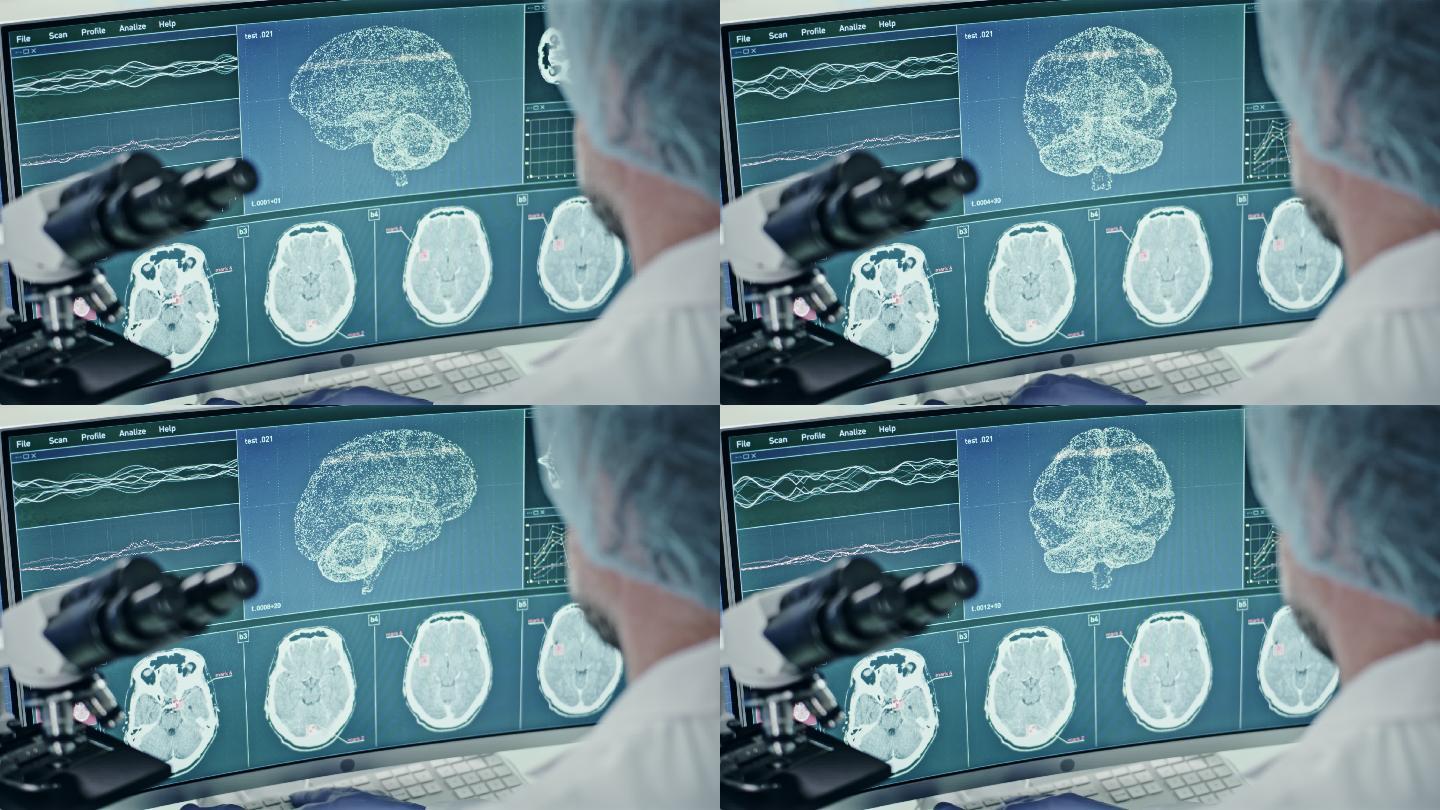 科学家和显微镜。计算机屏幕上的脑电波扫描研究