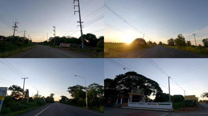 时间推移：早上在乡村公路上行驶的汽车的前视图。