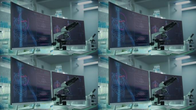 拥有计算机和显微镜的现代化实验室。带有动画人体模型的屏幕。扫描虚拟病人的受伤情况。有红色标记的肩膀