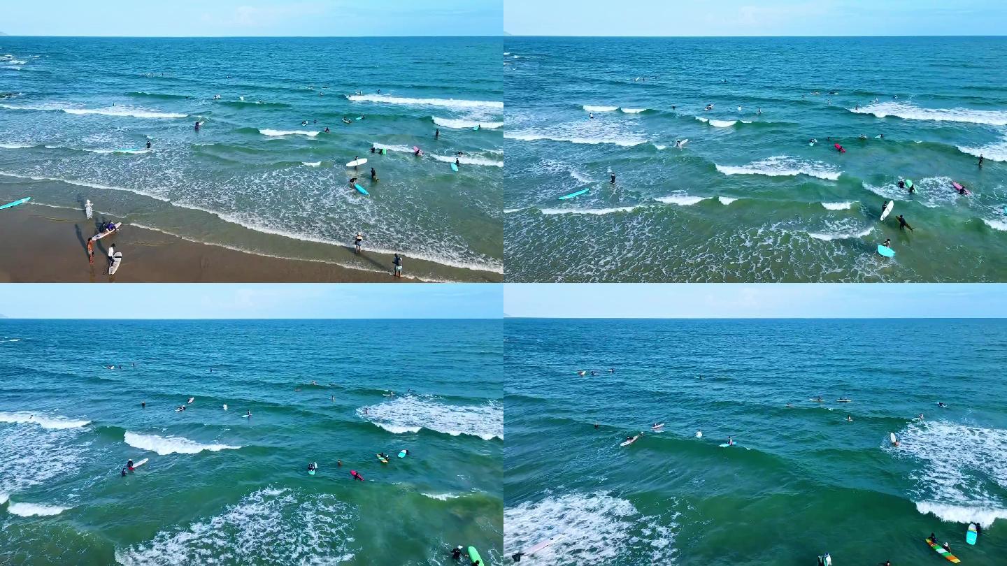 夏日海边冲浪人群海边游客海南旅游海滩海浪