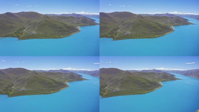 晴天航拍羊卓雍错和远处的雪山