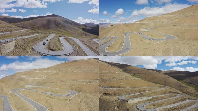 航拍越野车行驶在西藏珠峰108拐盘山公路