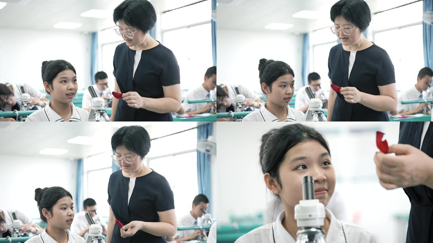 老师带学生使用显微镜