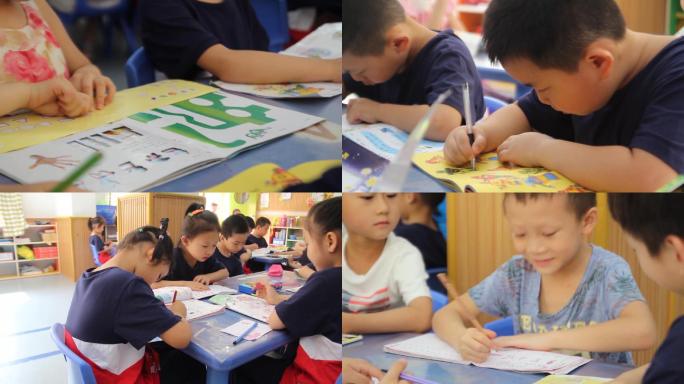 幼儿园孩子在教室里读书写字