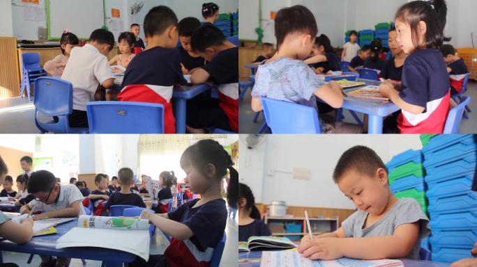 幼儿园孩子在教室看书写字画画