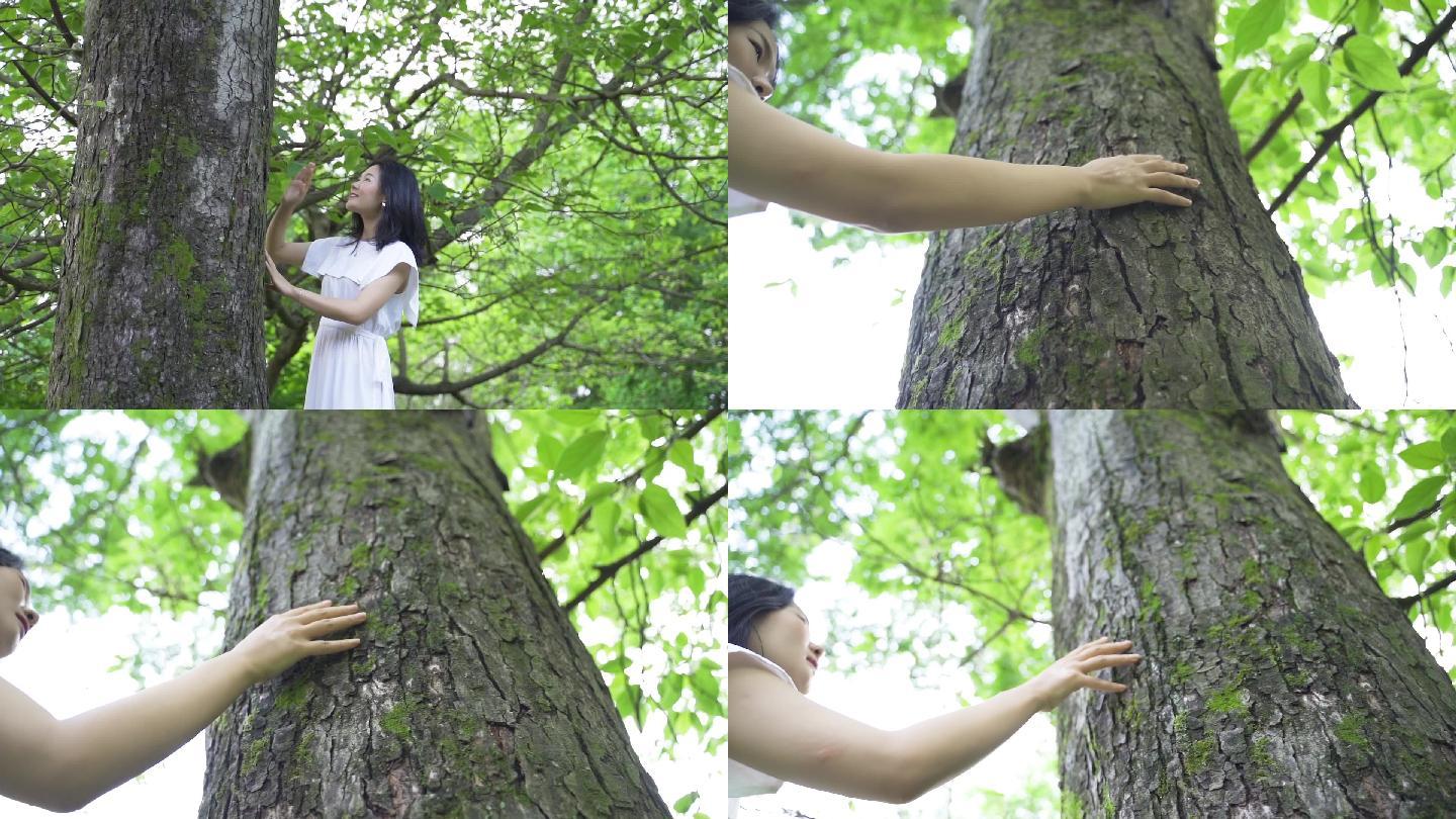 女孩森林亲近自然抚摸树干写意人与自然探寻