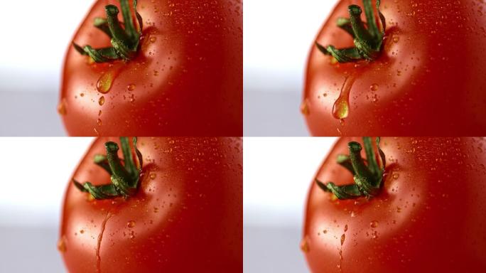 一滴水从番茄上滑落下来
