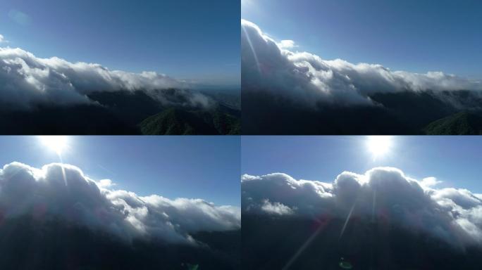 高山云层间旋转拍摄厚重云墙及太阳